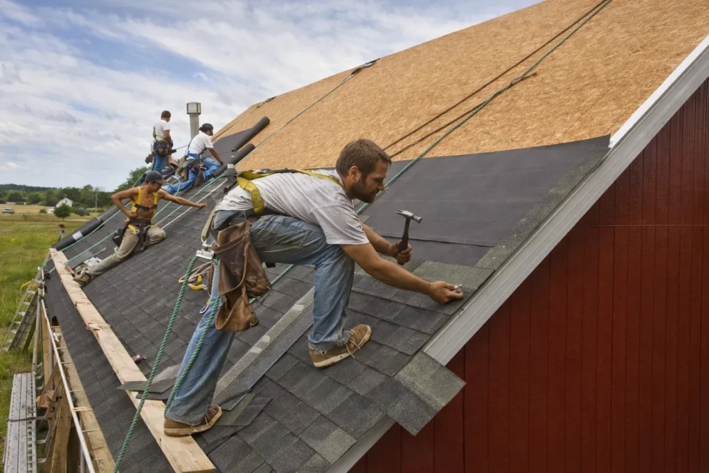 Shingle Roof Replacement with workers at work